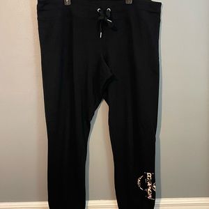 Calvin Klein joggers. Leopard “CK” detail at the bottom of leg.